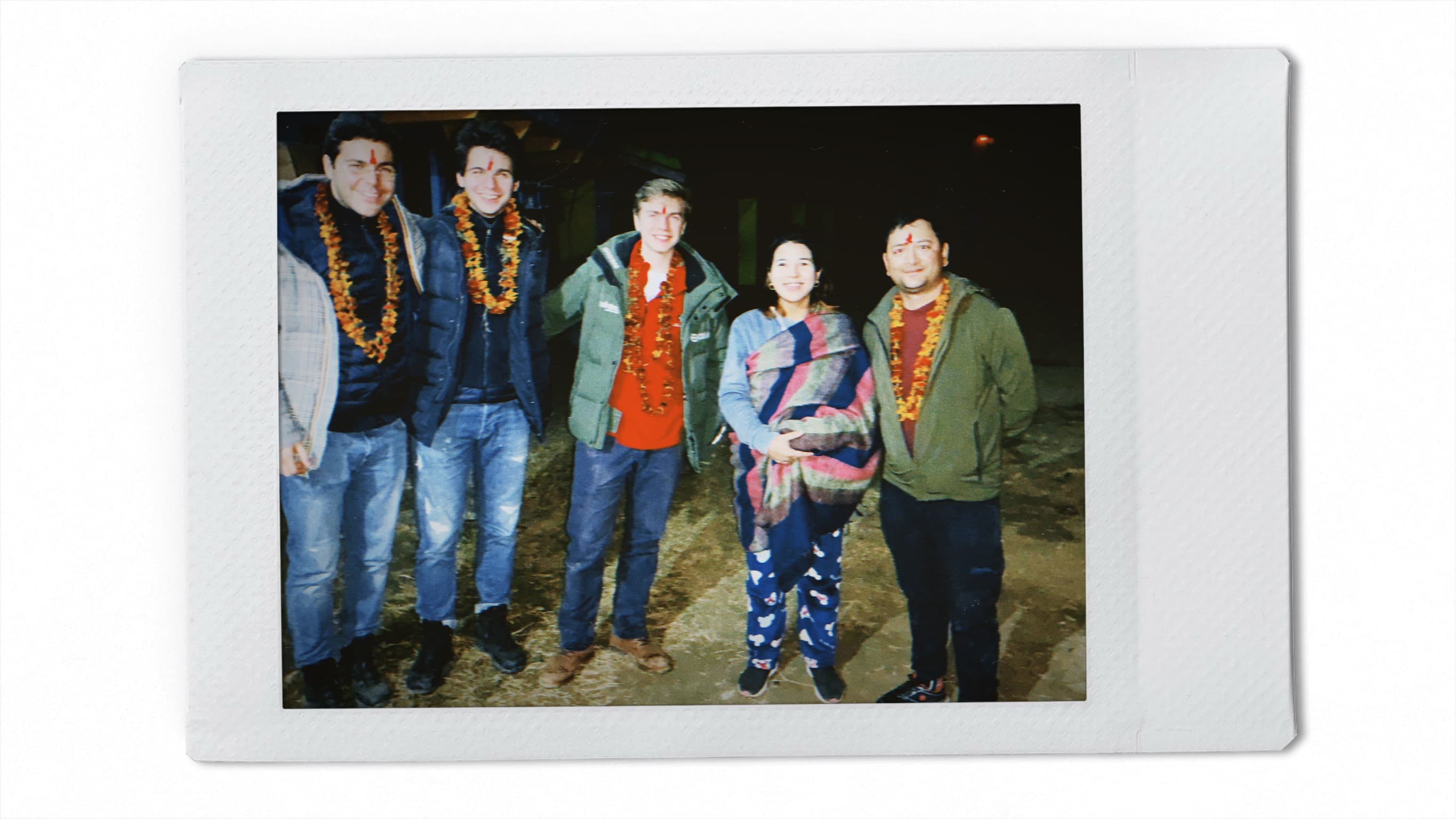Our team wearing flower necklaces